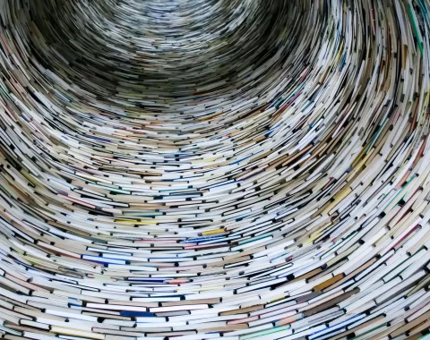 A spiral of books, symbolizing the vast amount of Czech culture accessible to everyone, even without advanced Czech language skills.
